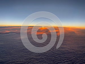 Sunset above the clouds up in the sky - planet earth