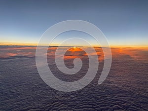 Sunset above the clouds up in the sky - planet earth