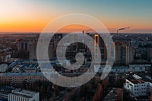 Sunset above evening Voronezh. Aerial view of construction of modern residential area