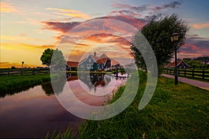 Sunset above historic farm houses in the holland village of Zaanse Schans