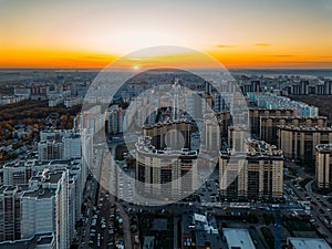 Sunset above modern residential area in Voronezh, aerial view from drone