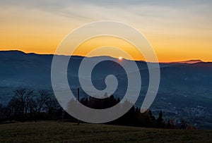 Sunset above Moravskoslezske Beskydy mountains from Bahenec hill in Slezske Beskydy mountains in Czech republic