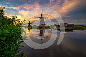 Sunset above old dutch windmill in Kinderdijk, Netherlands