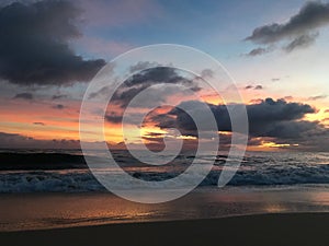 Sunset above Pacific Ocean - View from Beach in Kekaha on Kauai Island, Hawaii, Niihau Island on Horizon.