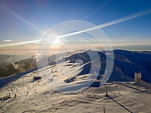 Západ slunce nad sjezdovkou na Slovensku Tatry