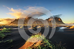 Sunset above Vestrahorn and its black sand beach in Iceland