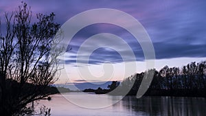 Sunset on the Adige river, Rovigo, Italy.