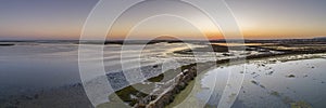 Sunset aerial panoramic seascape view of Olhao salt marsh Inlet