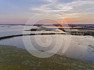 Sunset aerial seascape view of Olhao salt marsh Inlet