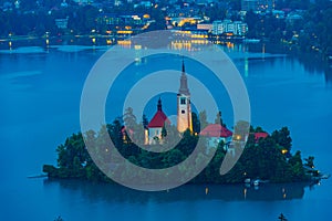 Sunset aerial view of Assumption of Maria church at lake Bled in