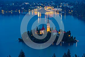 Sunset aerial view of Assumption of Maria church at lake Bled in