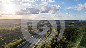 Sunset Aerial View of E42 Highway Winding Through Hautes Fagnes