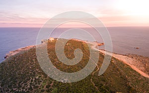 Sunset aerial view of the island of Portopalo and its coastline, Sicily, Italy photo