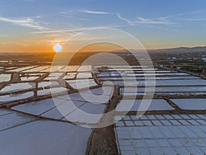 Sunset aerial view, in Ria Formosa wetlands natural park, salt pans. Algarve