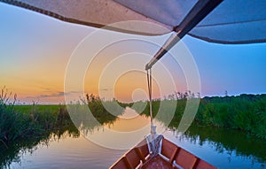 Sunset on the Albufera Canal boats in El Palmar in Valencia Spain