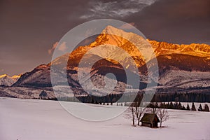 Sunset with the amazingly lit peak of the High Tatras Krivan