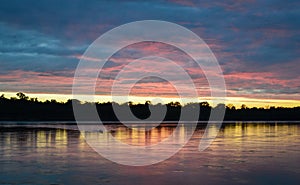 Sunset on the amazon rainforest in the Madre de Dios region , Peru.