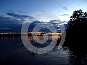 The sunset on Amazon river in Peru, South America
