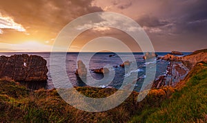 Sunset Arnia Beach (Spain, Atlantic Ocean) coastline landscape