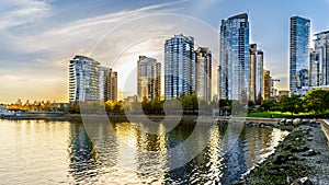 Sunset as the sun is setting behind modern Skyscapers lining the skyline of Yaletown