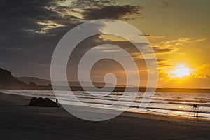 Sunset on Asturias beach. Clouds over the Cantabrian Sea photo