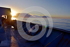 Sunset on the Atlantic ocean taken from the cargo container ship from forward manoeuvring station.