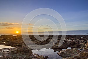 Sunset Atlantic Ocean view at Dar Bouazza beach, in Tamarist,