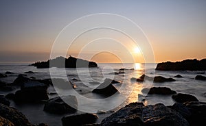 The sunset at the background in the atlantic ocean, Punta Ballena, Maldonado, Uruguay