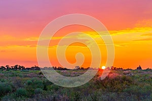 Sunset background, Panorama view with wonderful golden yellow sky, Amazing purple and orange sky in evening during the sun going