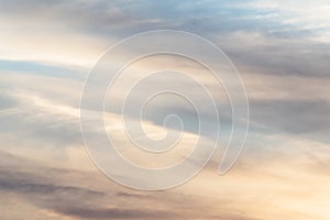 Sunset background. sky with soft and blur pastel colored clouds. sunshine through the gradient cloud on the beach resort. nature