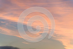 Sunset background. sky with soft and blur pastel colored clouds. sunshine through the gradient cloud on the beach resort. nature