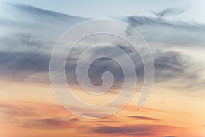 Sunset background. sky with soft and blur pastel colored clouds. sunshine through the gradient cloud on the beach resort. nature