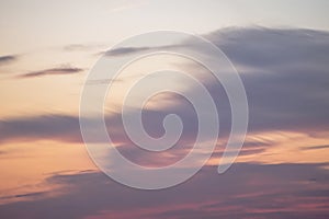 Sunset background. sky with soft and blur pastel colored clouds. sunshine through the gradient cloud on the beach resort. nature