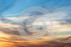 Sunset background. sky with soft and blur pastel colored clouds. sunshine through the gradient cloud on the beach resort. nature