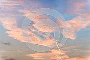 Sunset background. sky with soft and blur pastel colored clouds. sunshine through the gradient cloud on the beach resort. nature