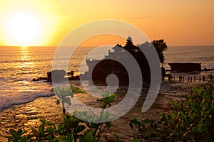 Sunset at Bali\'s famous Tanah Lot temple, Indonesia photo