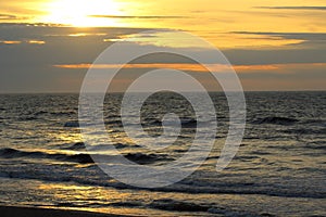 Sunset at the baltic sea beach of ustronie morskie, poland