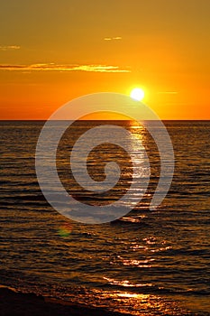 Sunset at the baltic sea beach of ustronie morskie, poland