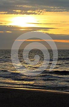 Sunset at the baltic sea beach of ustronie morskie, poland