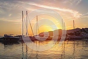 Sunset in Baska Voda town with Adriatic Sea and boats, Croatia