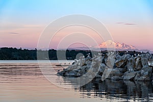 Sunset in the bay with snow mountain on the background