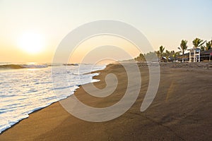 Sunset at Beach with Black Sand in Monterrico, Guatemala. Monterrico is situated on the Pacific coast in the department of Santa