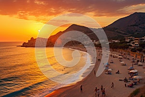 Sunset on the beach in Calpe, Alicante, Spain, Kaputas beach. People enjoy sun and sea at the beautiful turquoise sea and sandy