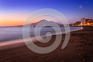 Sunset from a beach in Castellammare di Stabia and Mount Vesuvius and the Bay of Naples, Naples Napoli