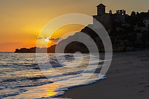 Sunset on the beach and a castle