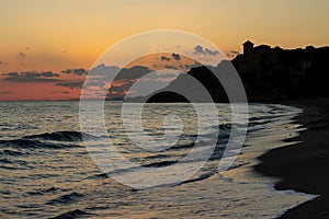 Sunset on the beach and a castle