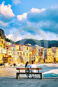 sunset at the beach of Cefalu Sicily, old town of Cefalu Sicilia panoramic view at colorful village