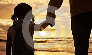 Sunset, beach and girl holding hands with father and silhouette for summer, family and vacation together. Hope, support