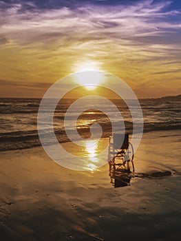 Sunset on the beach handicapped wheelchair