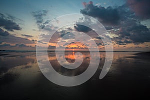 Sunset on the beach of Matapalo in Costa Rica photo